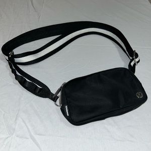 Lululemon cross body bag with white and black stripes